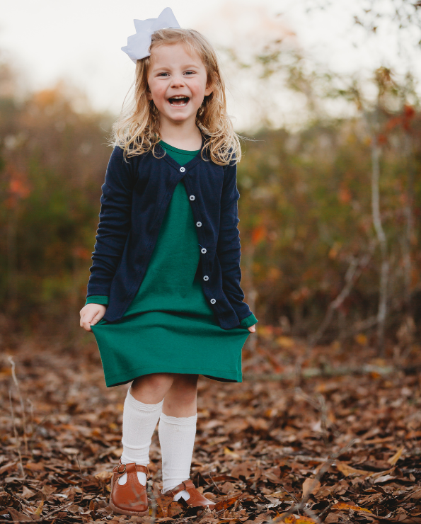 Girl wearing City Threads clothing in a comfortable dress in the Fall