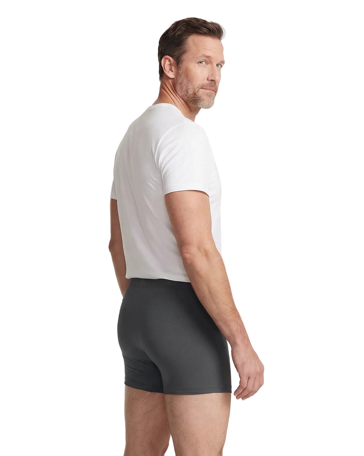Man wearing a white t-shirt and gray boxer briefs on a light background