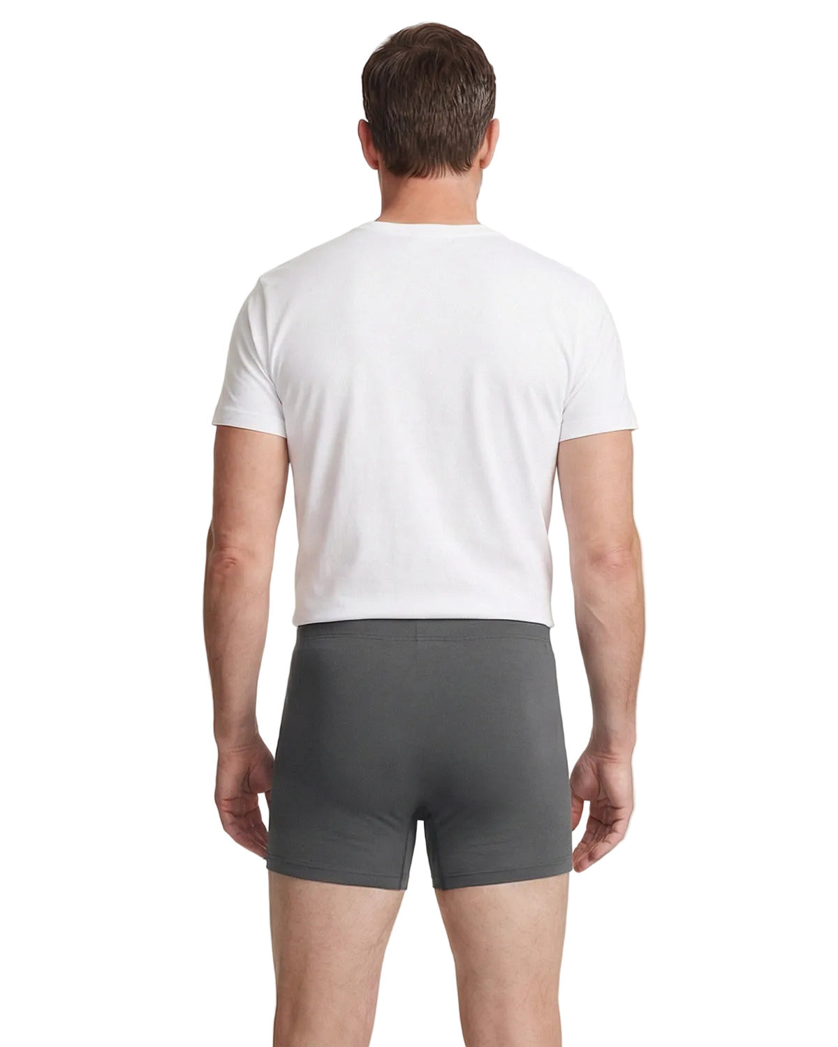 Man wearing a white t-shirt and gray underwear on a plain background