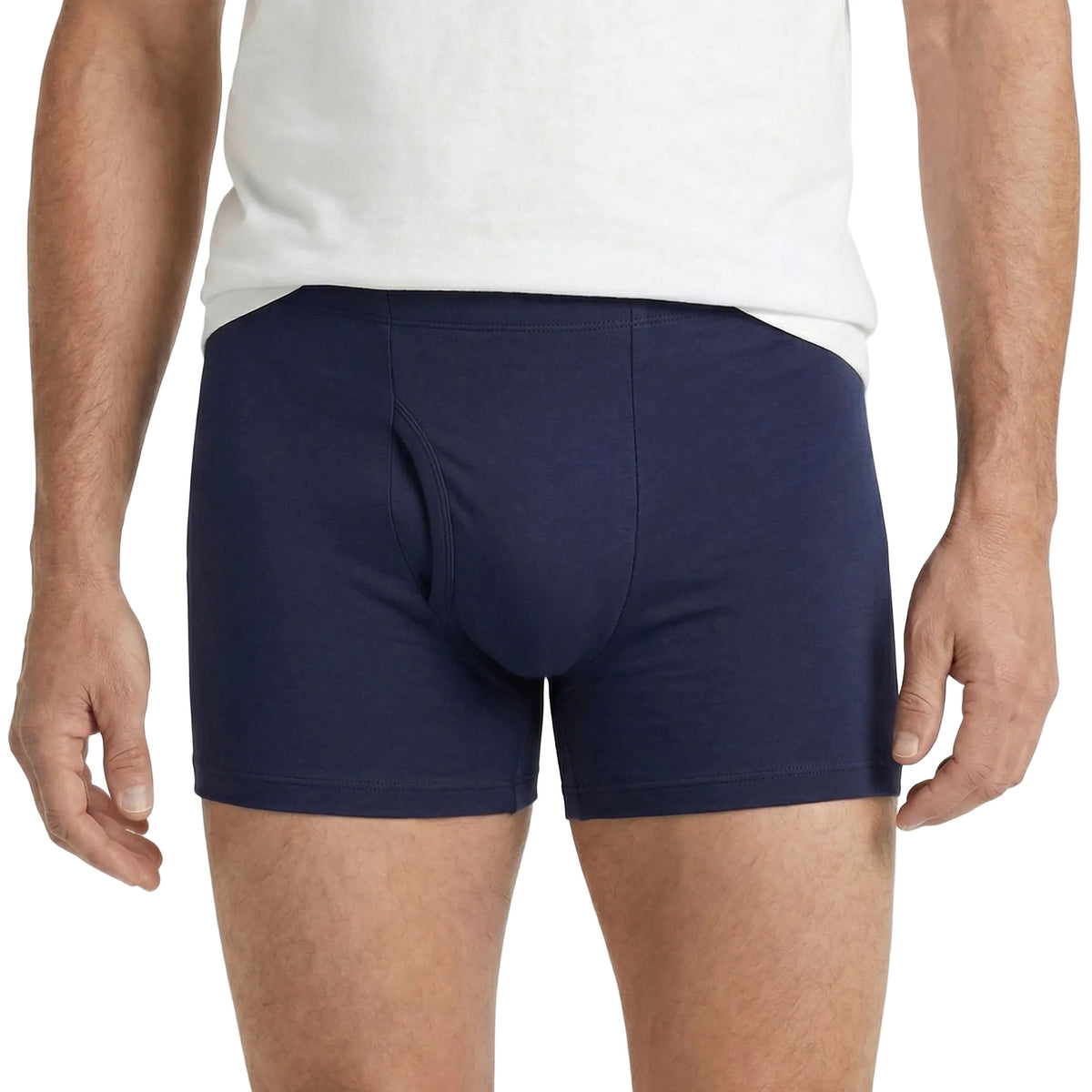 Person wearing navy boxer briefs on a white background
