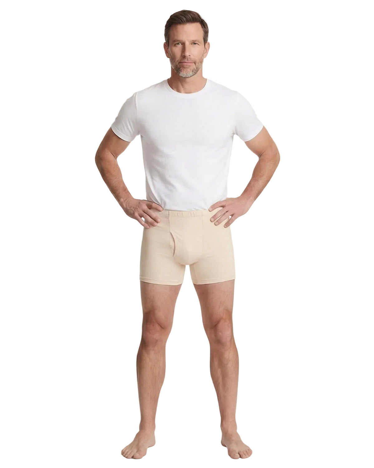 Man wearing beige boxer briefs and a white t-shirt on a white background