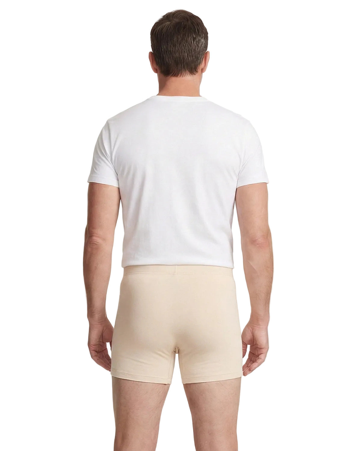 Man wearing a white t-shirt and beige shorts on a plain background