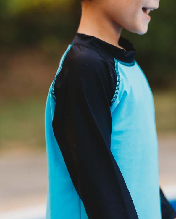 Boys UPF 50+ Color Block Solid Long Sleeve Rashguard | Bright Light Blue with Black