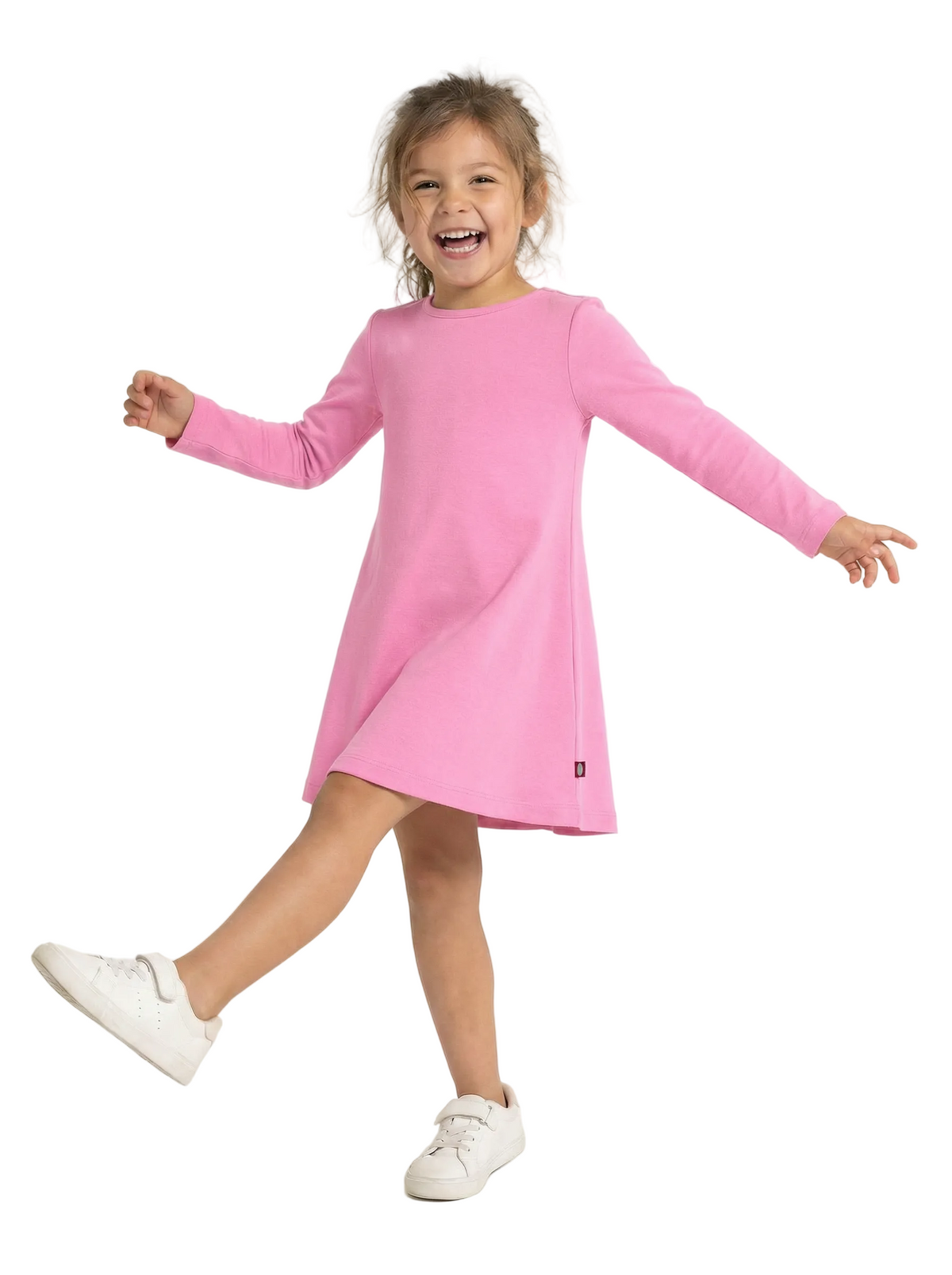 Child wearing a pink dress on a white background