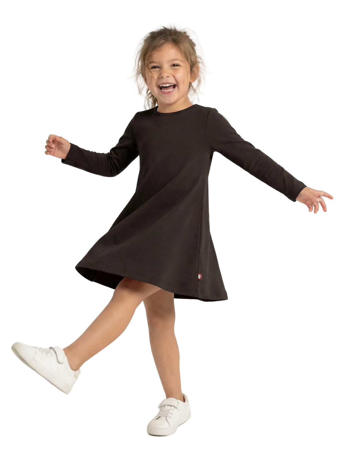 Child wearing a black dress with long sleeves on a white background