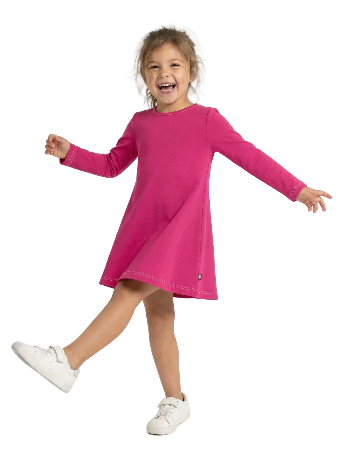 Child wearing a pink dress on a white background