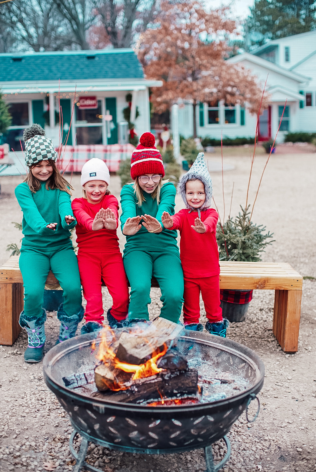 Kids getting warm by the fire in the winter